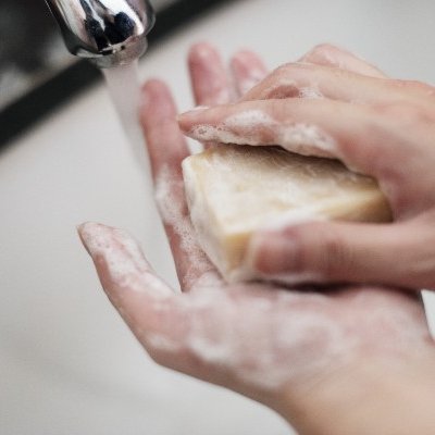 Hands washing with soap.